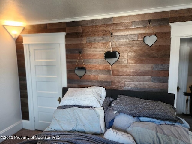 bedroom with wood walls