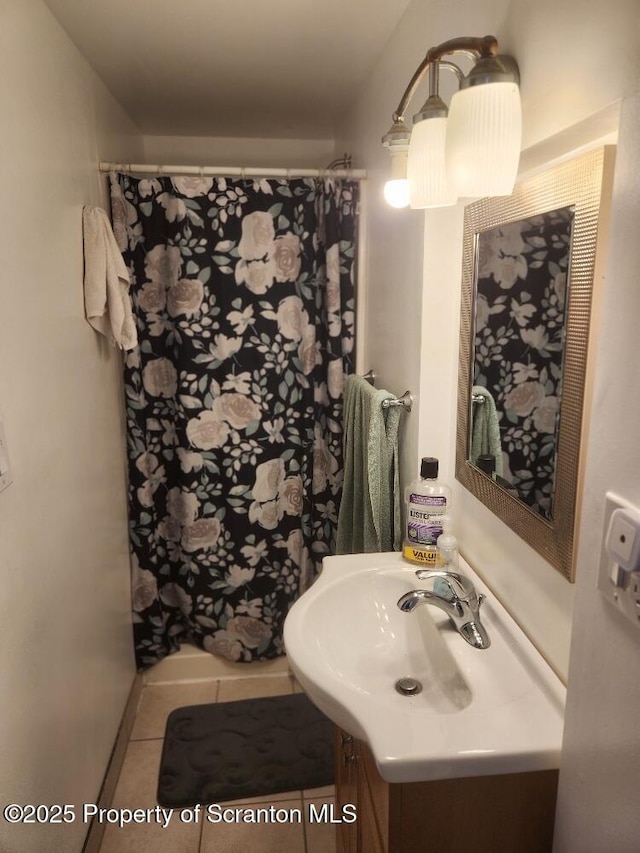 full bathroom featuring curtained shower, tile patterned flooring, and vanity