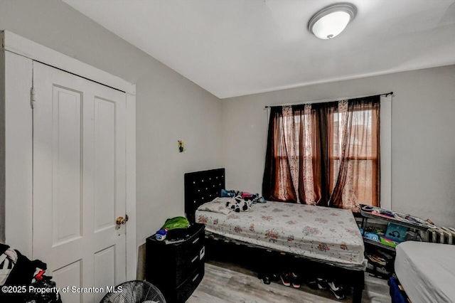 bedroom with wood finished floors