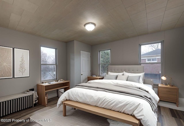 bedroom with wood finished floors