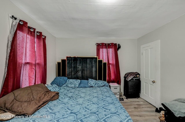 bedroom featuring wood finished floors