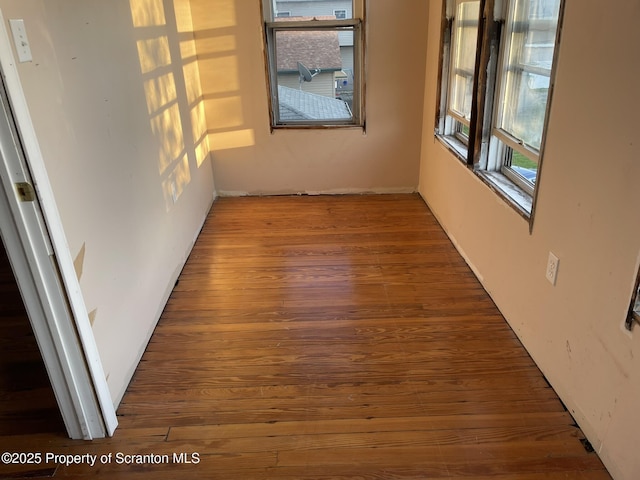 spare room featuring dark hardwood / wood-style flooring