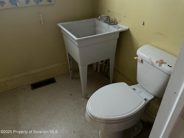 bathroom featuring toilet