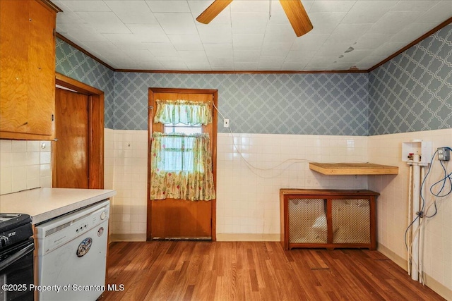 205 Lackawanna Ave, Duryea, PA 18642 - kitchen with white dishwasher, wood finished floors, crown molding, wallpapered walls, and ceiling fan