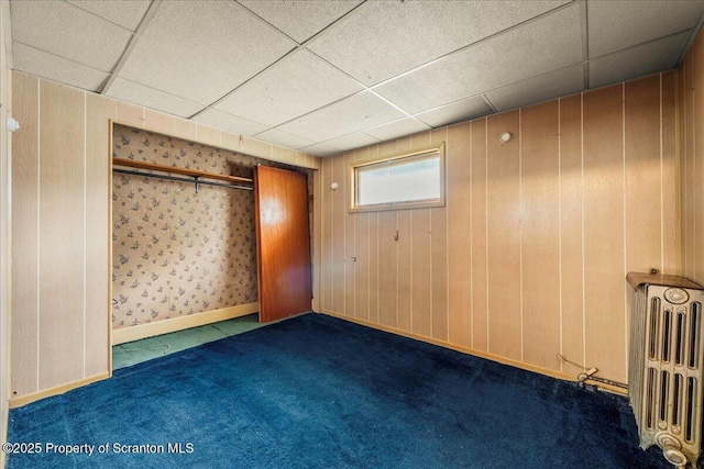 205 Lackawanna Ave, Duryea, PA 18642 - carpeted spare room featuring radiator heating unit and a paneled ceiling