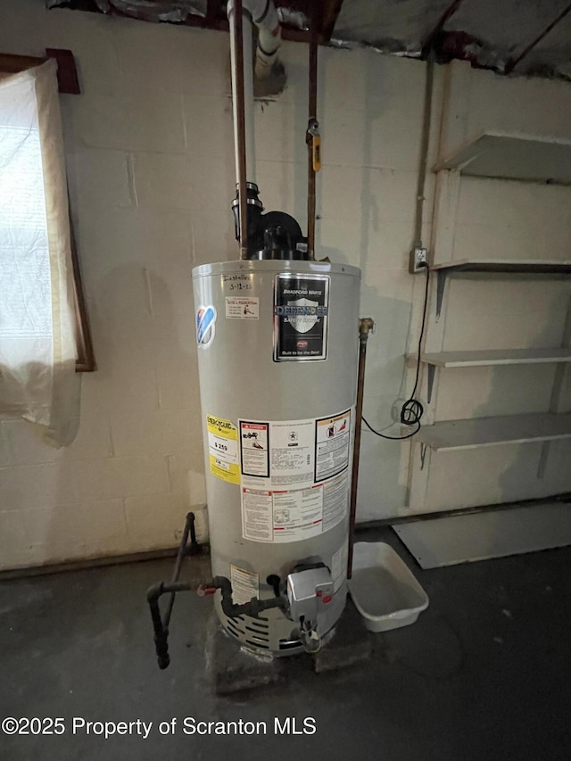 utility room featuring gas water heater