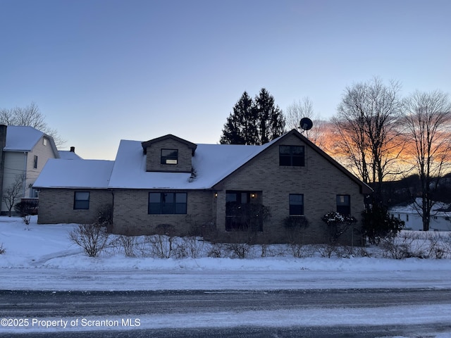 view of front of home featuring brick siding