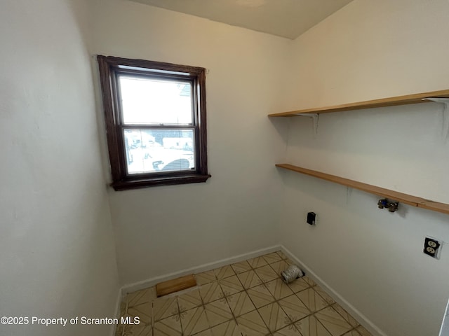 laundry area featuring hookup for a washing machine, laundry area, hookup for an electric dryer, and baseboards