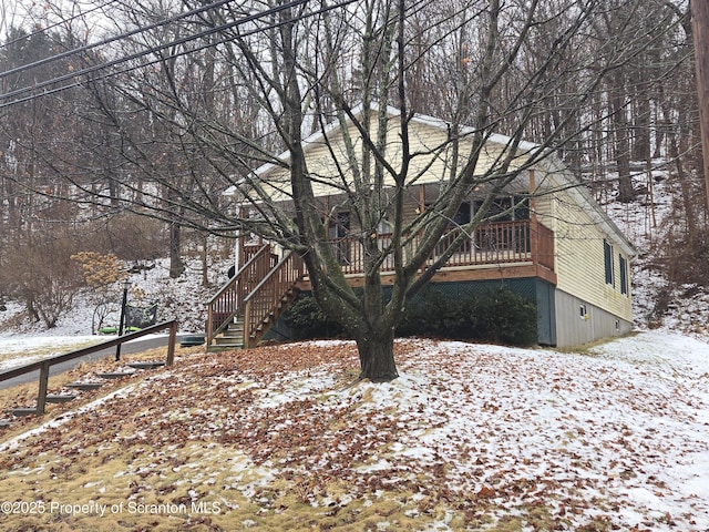 exterior space with stairway and a deck