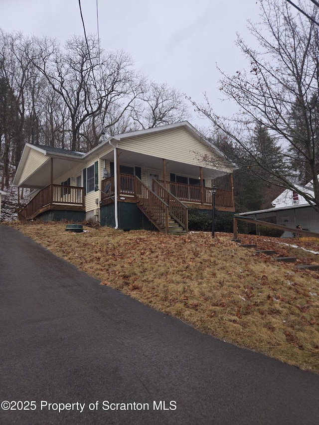 view of property exterior with stairs