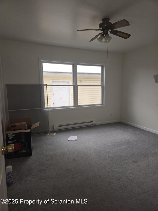 carpeted empty room featuring baseboards, baseboard heating, and a ceiling fan