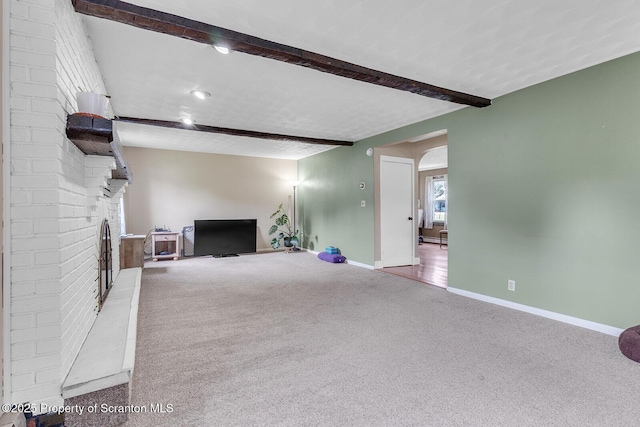 50 Humphrey St Unit 50-51, Old Forge, PA 18518 - unfurnished living room with carpet flooring and beamed ceiling