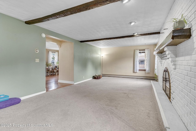 50 Humphrey St Unit 50-51, Old Forge, PA 18518 - unfurnished living room featuring carpet flooring, a baseboard heating unit, beam ceiling, and a brick fireplace