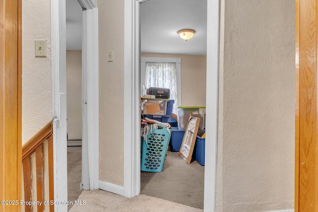 50 Humphrey St Unit 50-51, Old Forge, PA 18518 - hallway with a textured wall, carpet flooring, and a baseboard radiator