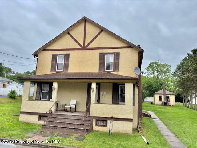 50 Humphrey St Unit 50-51, Old Forge, PA 18518 - view of front of property with stucco siding, a porch, and a front yard