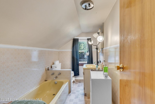 50 Humphrey St Unit 50-51, Old Forge, PA 18518 - bathroom featuring vanity, a bathtub, and vaulted ceiling