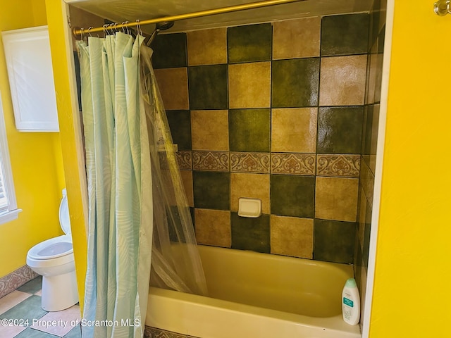 bathroom with tile patterned flooring, toilet, and shower / bath combo with shower curtain