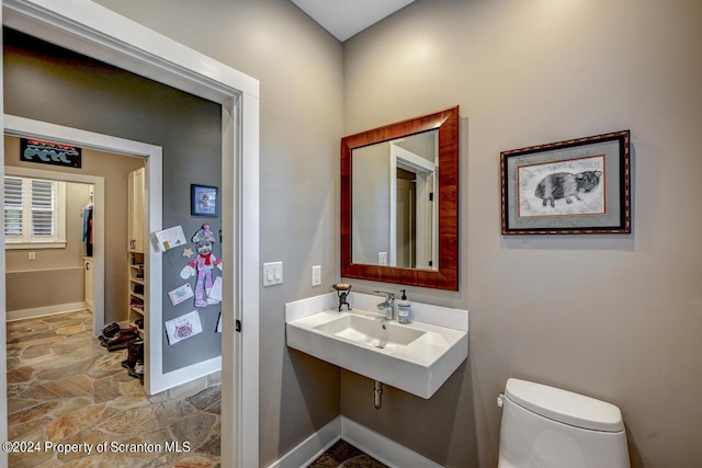 bathroom with toilet and sink