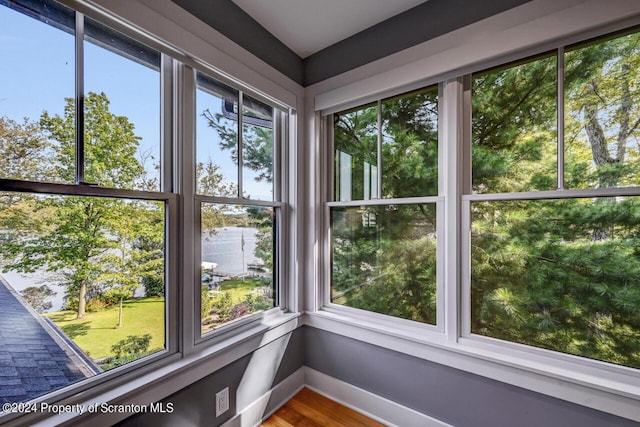 unfurnished sunroom with a wealth of natural light