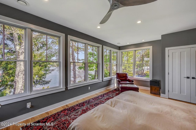 bedroom featuring ceiling fan and light hardwood / wood-style floors