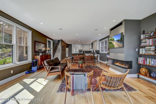 living room with light hardwood / wood-style flooring