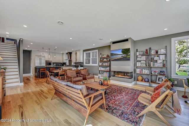 living room with light hardwood / wood-style floors