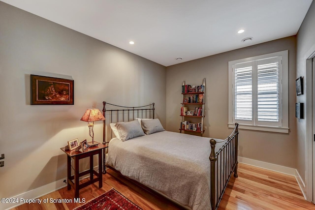 bedroom with light wood-type flooring