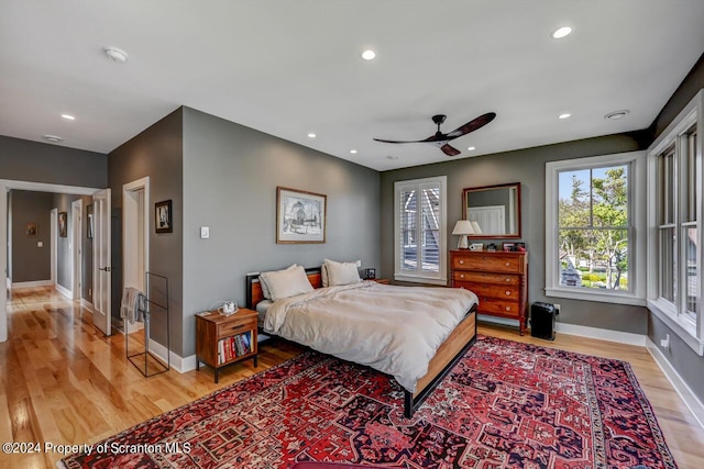 bedroom featuring light hardwood / wood-style floors and ceiling fan