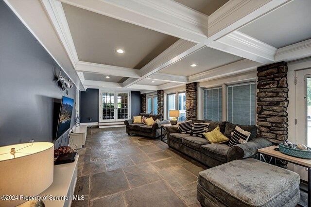 living room with beamed ceiling, crown molding, and coffered ceiling