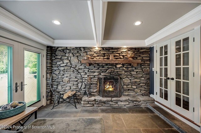 living room with beam ceiling and french doors