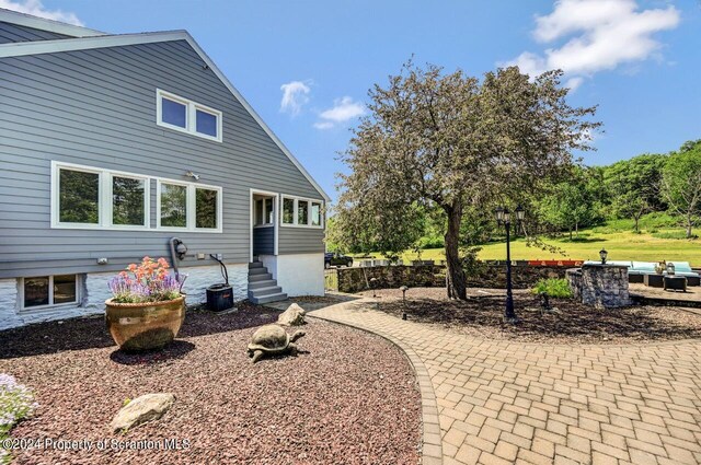 back of house with a patio