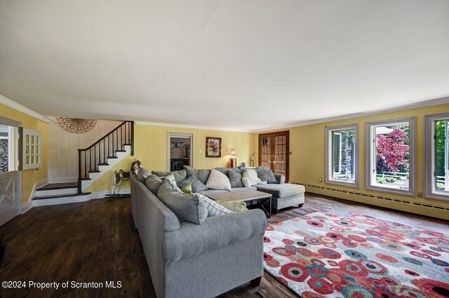 living room with hardwood / wood-style flooring, ornamental molding, and baseboard heating