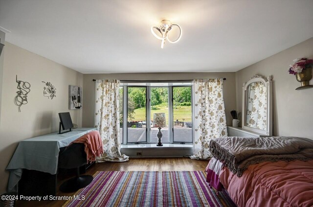 bedroom featuring hardwood / wood-style floors