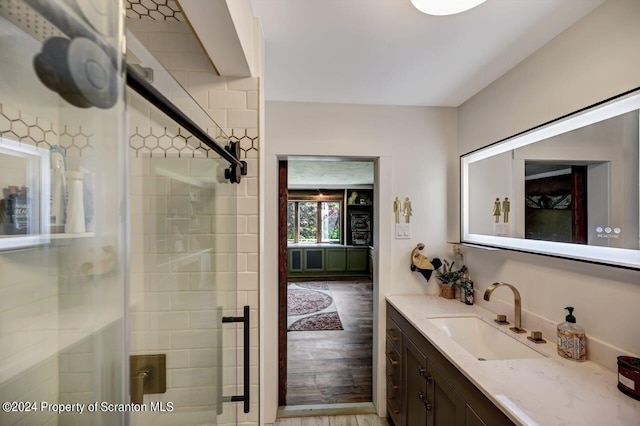 bathroom with vanity and an enclosed shower