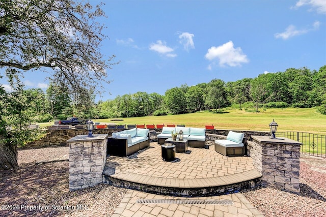 view of patio / terrace featuring an outdoor hangout area and an outdoor kitchen