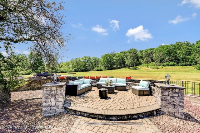 view of patio / terrace featuring an outdoor hangout area and an outdoor kitchen