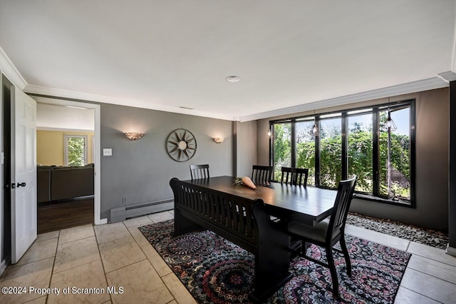 dining space featuring a baseboard radiator and ornamental molding