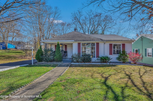 view of front of home with a front yard and a porch