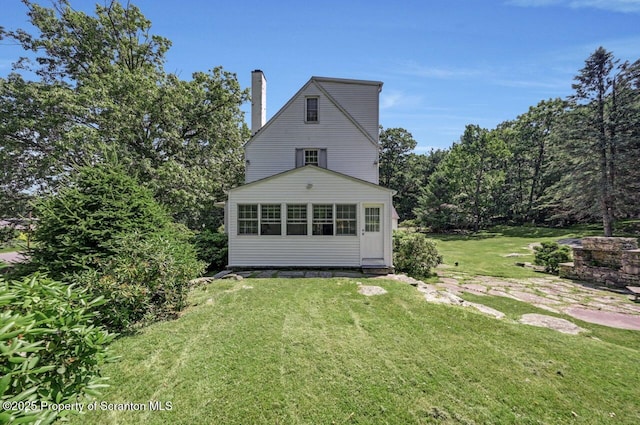 212 Lake Scranton Rd, Scranton, PA 18505 - rear view of property with a yard and a chimney