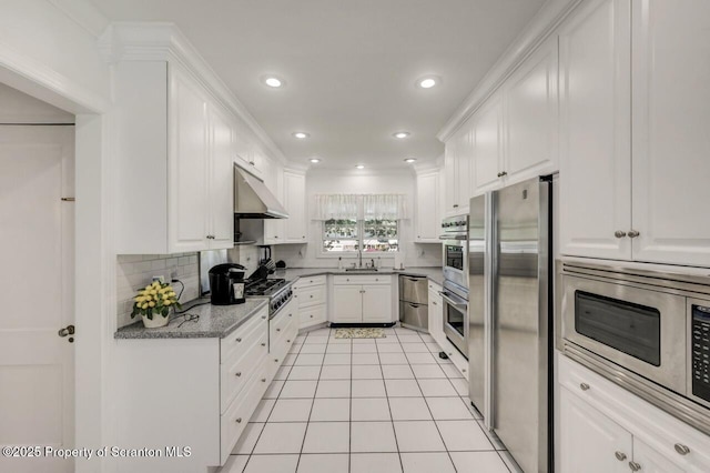 212 Lake Scranton Rd, Scranton, PA 18505 - kitchen featuring appliances with stainless steel finishes, white cabinetry, tasteful backsplash, and recessed lighting