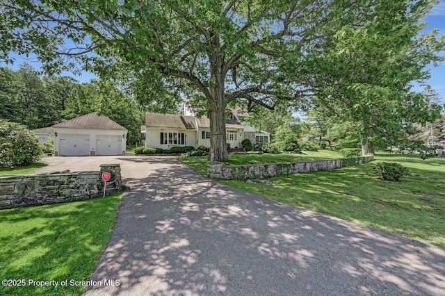 212 Lake Scranton Rd, Scranton, PA 18505 - view of front of property featuring a detached garage, an outdoor structure, a front yard, and view of scattered trees