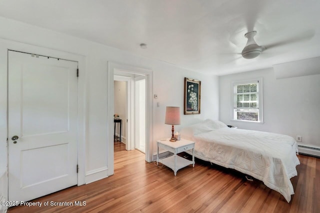 212 Lake Scranton Rd, Scranton, PA 18505 - bedroom featuring light wood finished floors, a baseboard radiator, and ceiling fan