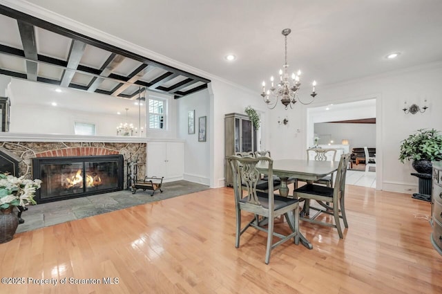 212 Lake Scranton Rd, Scranton, PA 18505 - dining space with a chandelier, a stone fireplace, wood finished floors, ornamental molding, and beamed ceiling