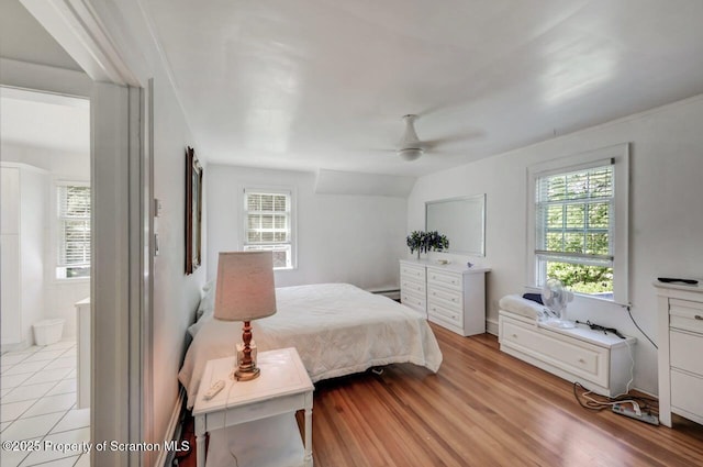 212 Lake Scranton Rd, Scranton, PA 18505 - bedroom featuring light wood-style floors, connected bathroom, a ceiling fan, and baseboard heating