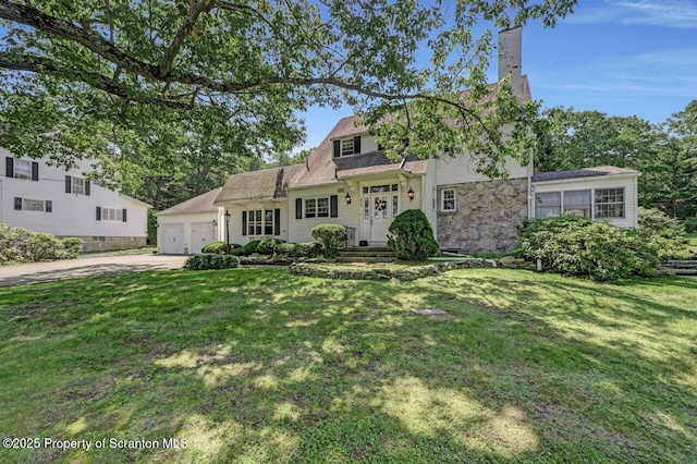 212 Lake Scranton Rd, Scranton, PA 18505 - view of front of house with a chimney, driveway, a front lawn, stone siding, and a garage