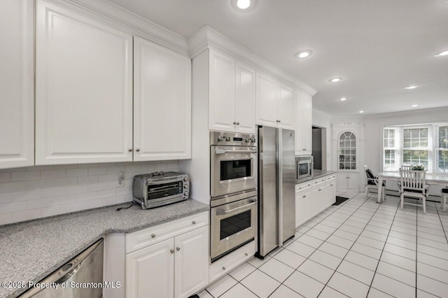 212 Lake Scranton Rd, Scranton, PA 18505 - kitchen featuring appliances with stainless steel finishes, backsplash, white cabinetry, light tile patterned floors, and recessed lighting