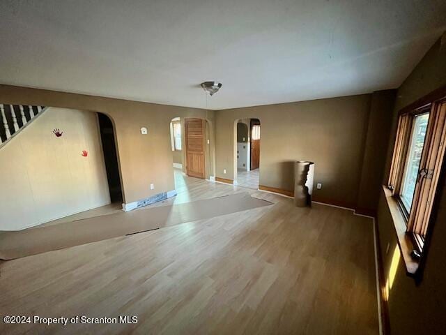 empty room with hardwood / wood-style floors