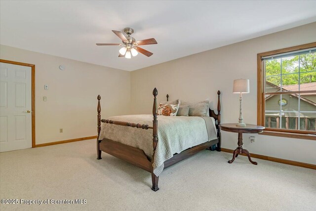 86 Paupack Point Rd, Hawley, PA 18428 - bedroom with light carpet, baseboards, and a ceiling fan