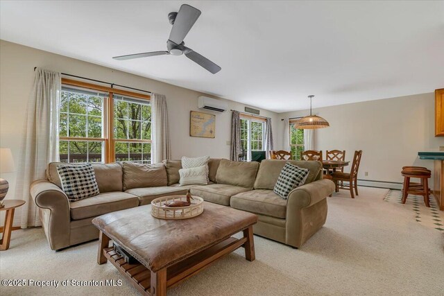 86 Paupack Point Rd, Hawley, PA 18428 - living room with a wall mounted AC, a baseboard radiator, light colored carpet, and ceiling fan