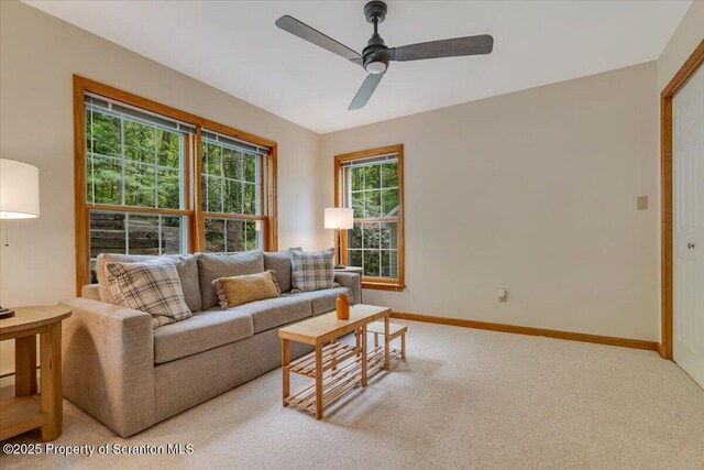 86 Paupack Point Rd, Hawley, PA 18428 - living room with carpet, baseboards, and ceiling fan